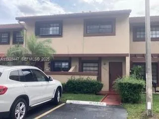 a car parked in front of a house