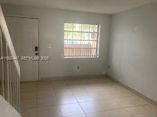 13320 Southwest 60th Terrace Miami, FL 33183 - Photo 2 of 14 a view of an empty room with a window
