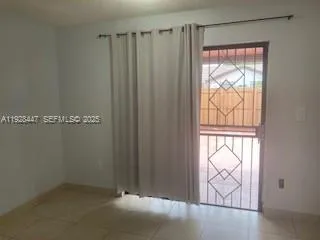 a view of a window in an empty room