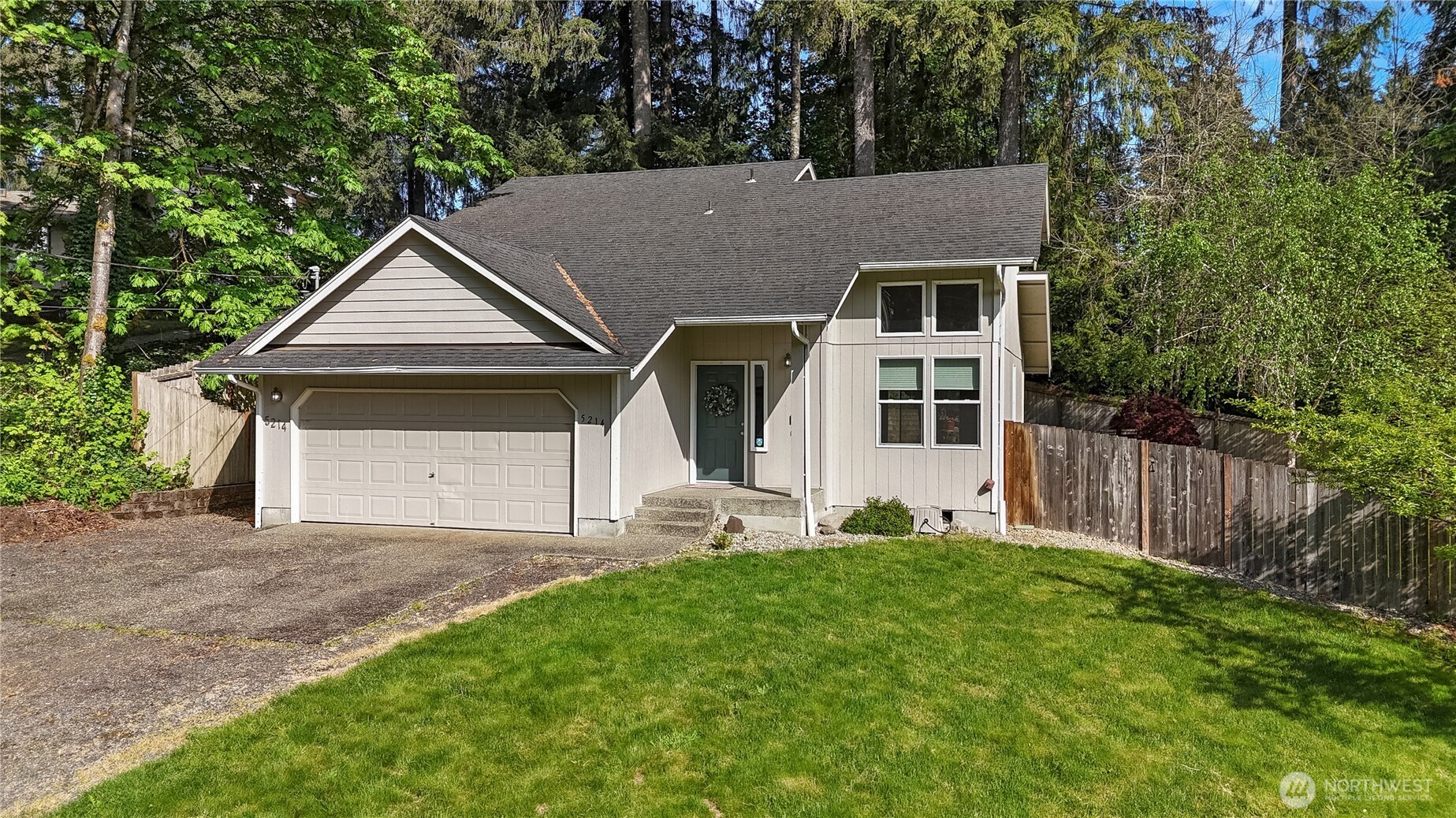 5214 78th Court Southwest Olympia, WA 98512 - Photo 1 of 27 a aerial view of a house with a yard and large tree