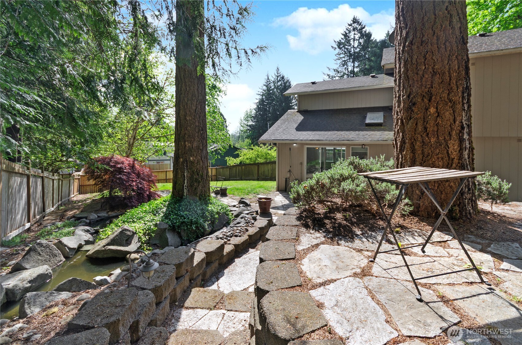 5214 78th Court Southwest Olympia, WA 98512 - Photo 19 of 27 a view of a chairs and table in backyard