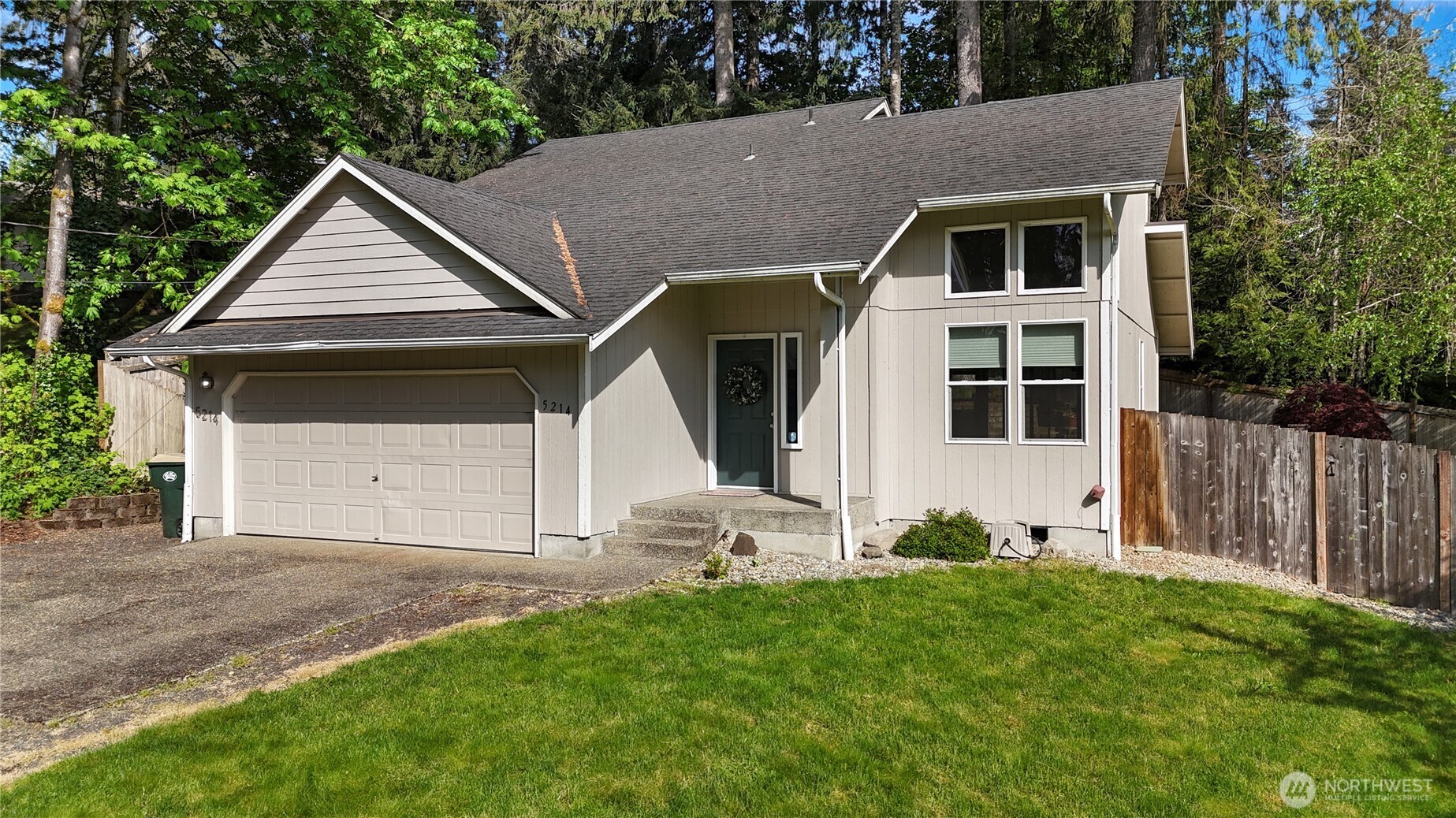 5214 78th Court Southwest Olympia, WA 98512 - Photo 24 of 27 a front view of a house with a yard