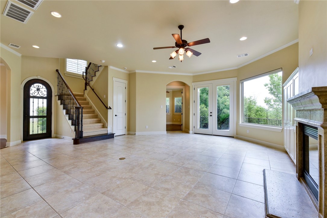 a view of a livingroom with furniture ceiling fan and window