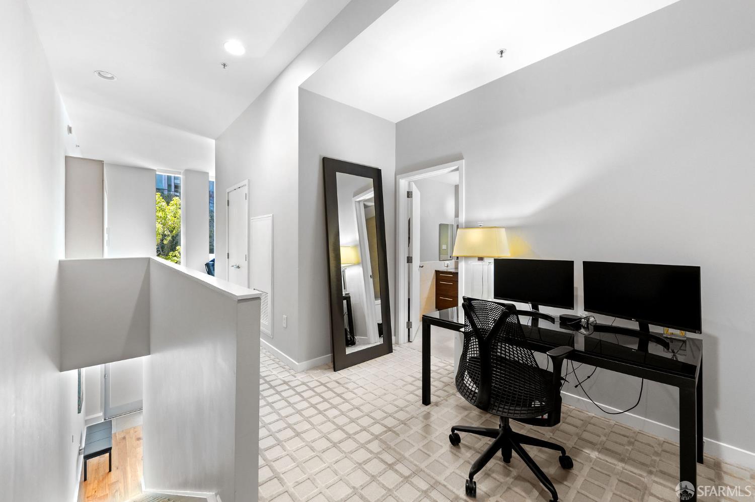 333 Main Street, Unit 2A San Francisco, CA 94105 - Photo 17 of 24 a view of a workspace with furniture and a window