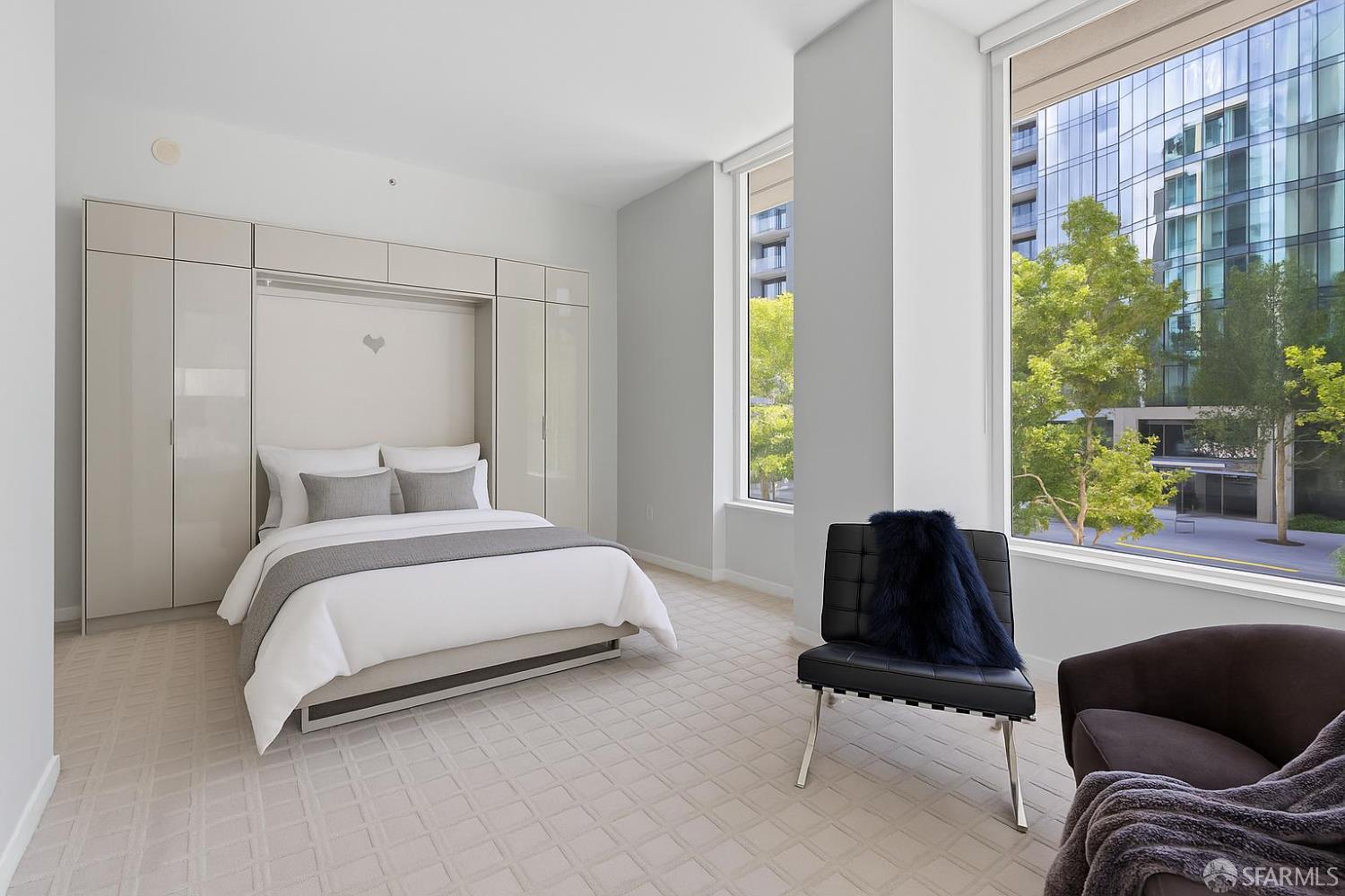 333 Main Street, Unit 2A San Francisco, CA 94105 - Photo 20 of 24 a spacious bedroom with a bed and a window