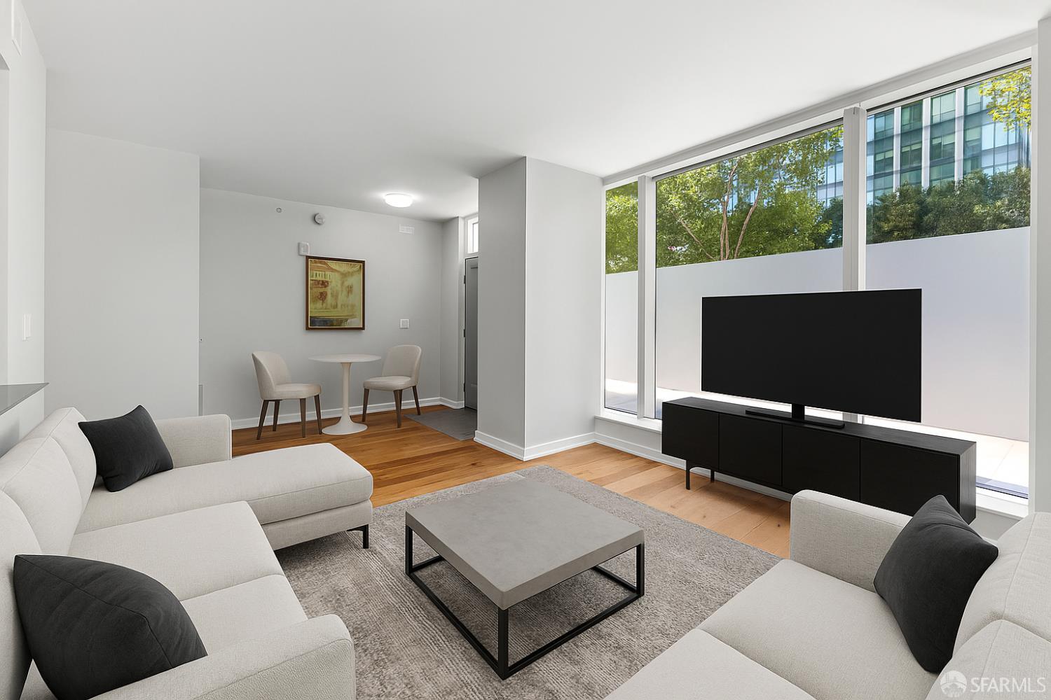 333 Main Street, Unit 2A San Francisco, CA 94105 - Photo 6 of 24 a living room with furniture and a flat screen tv
