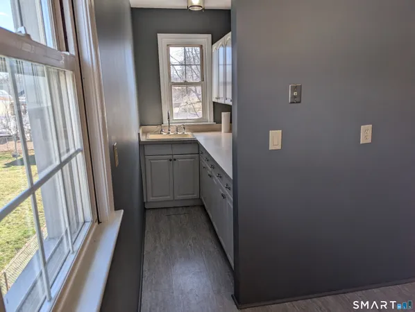 a view of a brick house with many windows