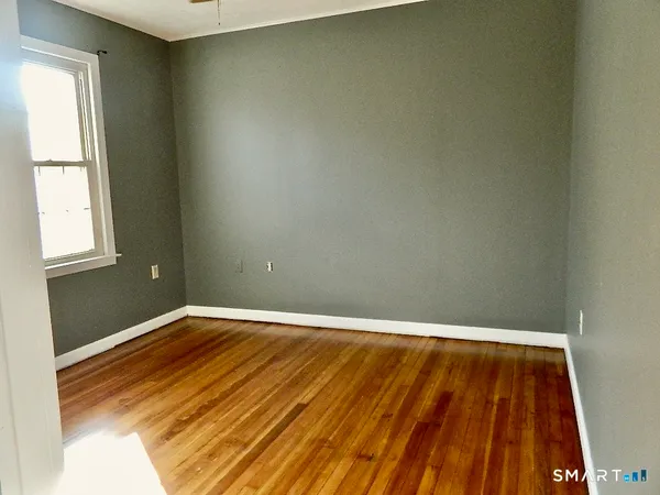 a view of staircase with rug
