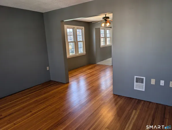 a kitchen with a refrigerator and a stove top oven