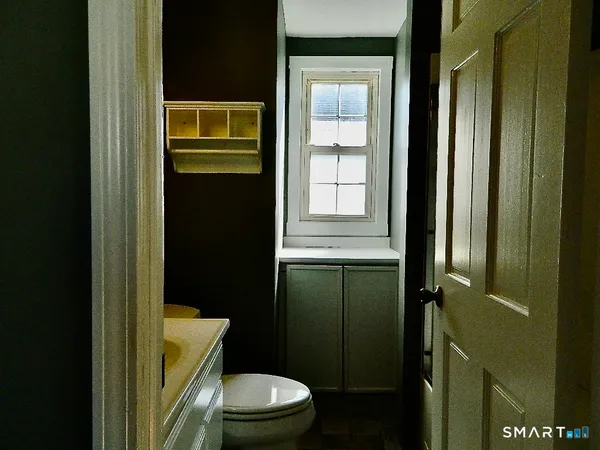 an empty room with wooden floor