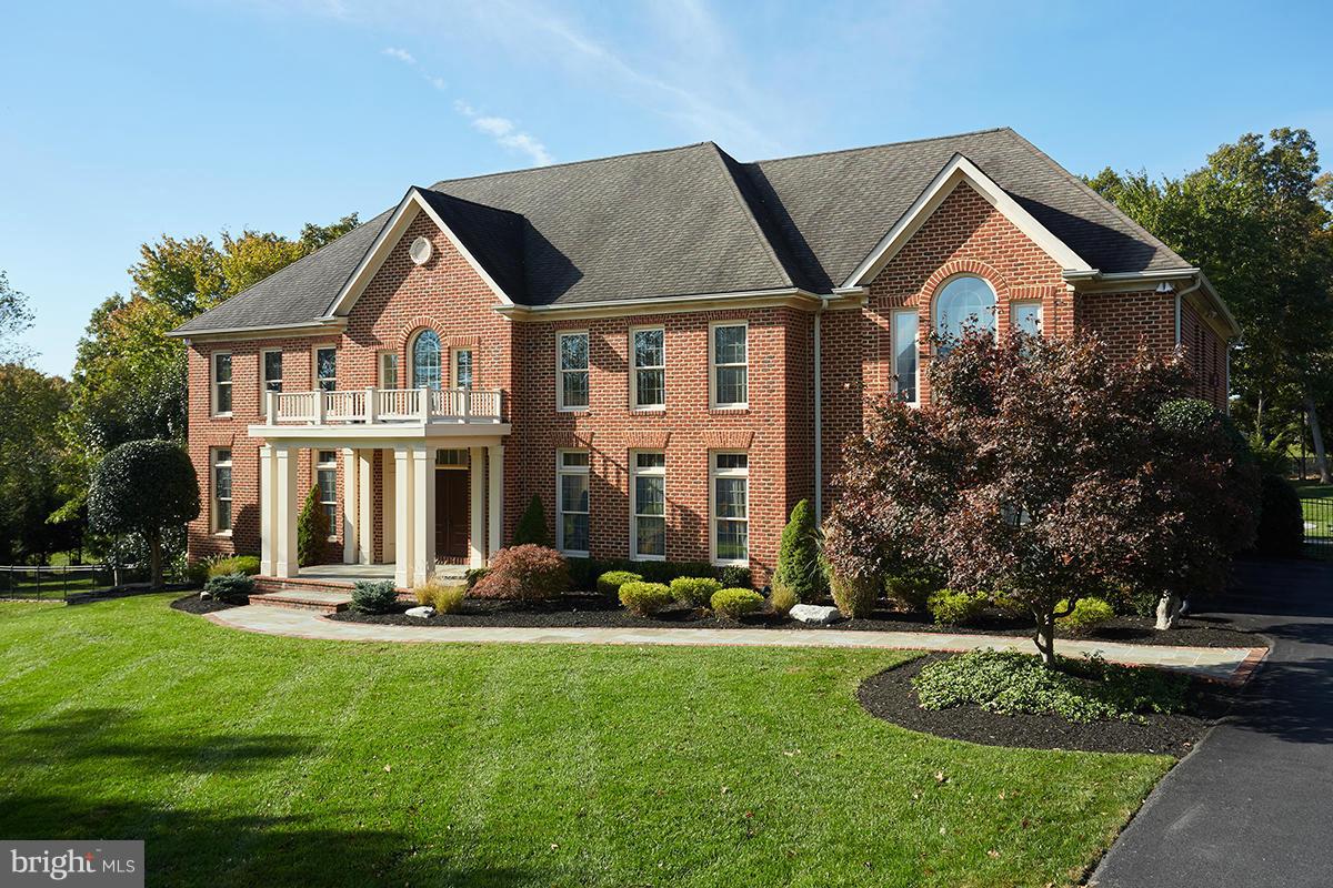 12636 Greenbriar Road Potomac, MD 20854 - Photo 1 of 30 a front view of house with yard and green space