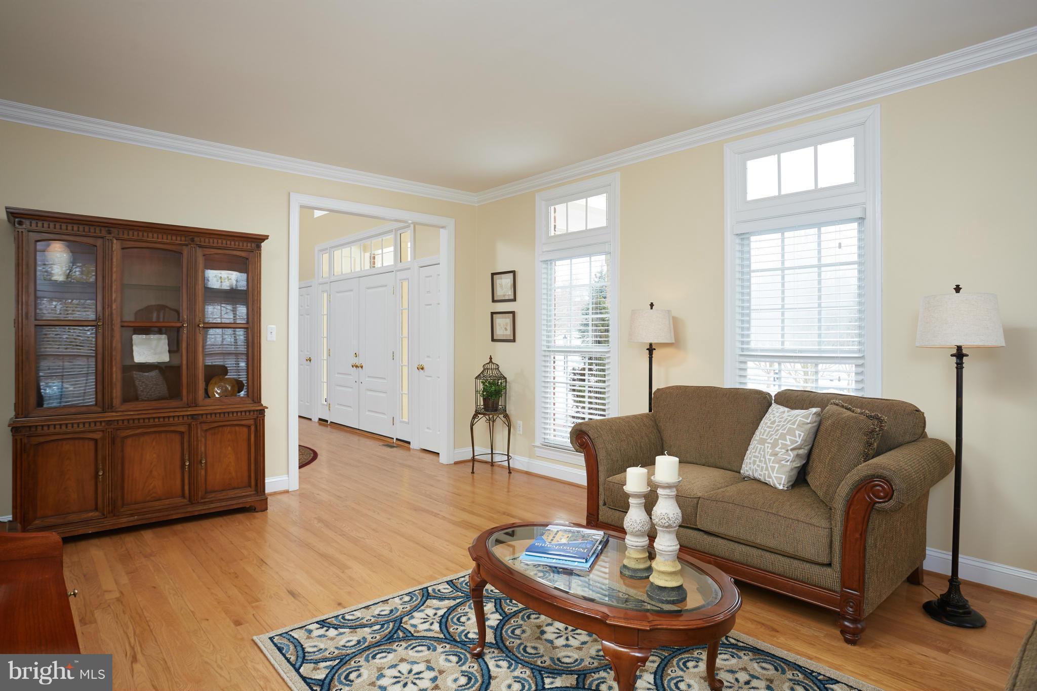 12636 Greenbriar Road Potomac, MD 20854 - Photo 3 of 30 a living room with furniture and wooden floor