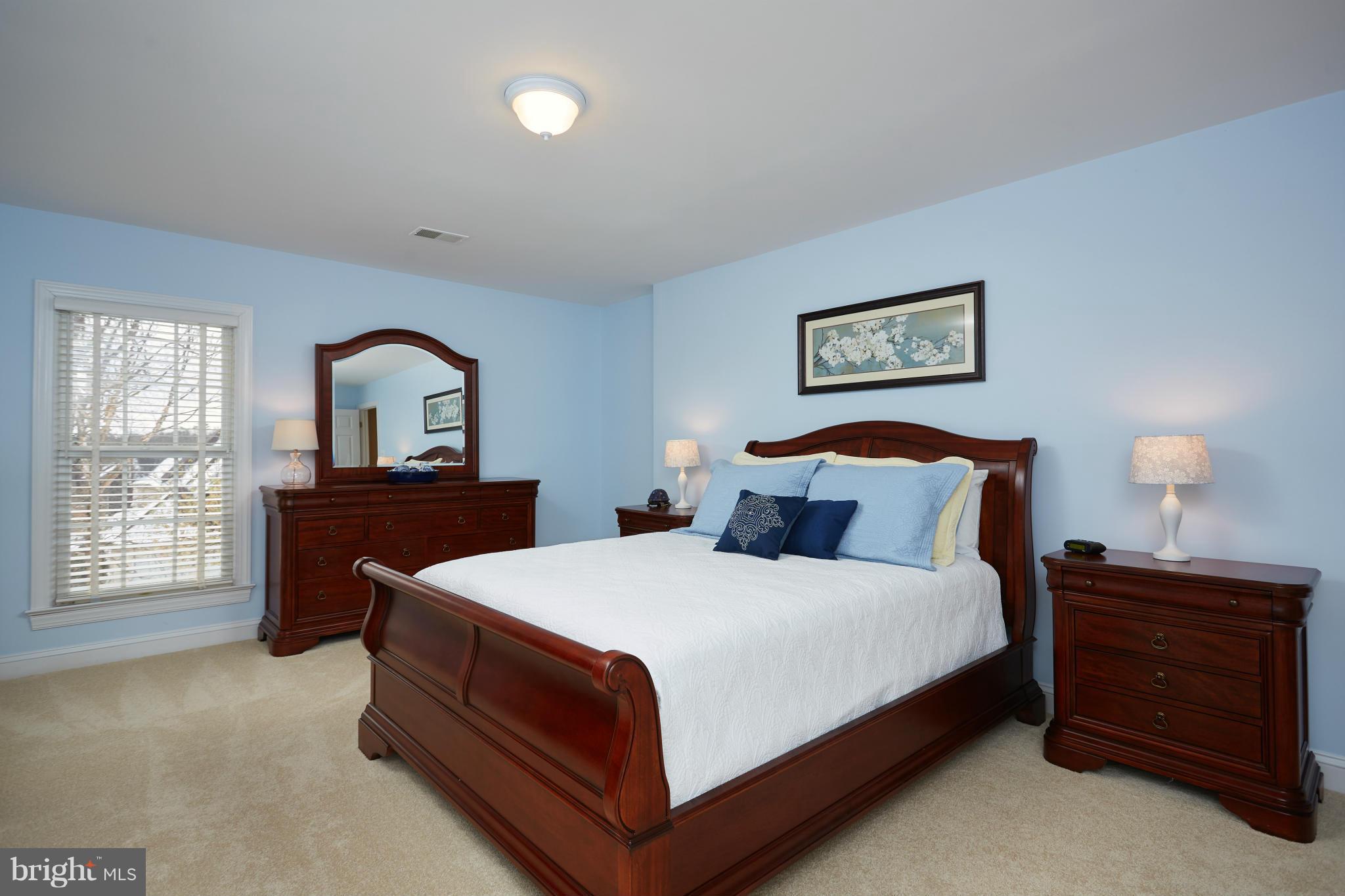 12636 Greenbriar Road Potomac, MD 20854 - Photo 21 of 30 a bedroom with a bed and a dresser next to a window