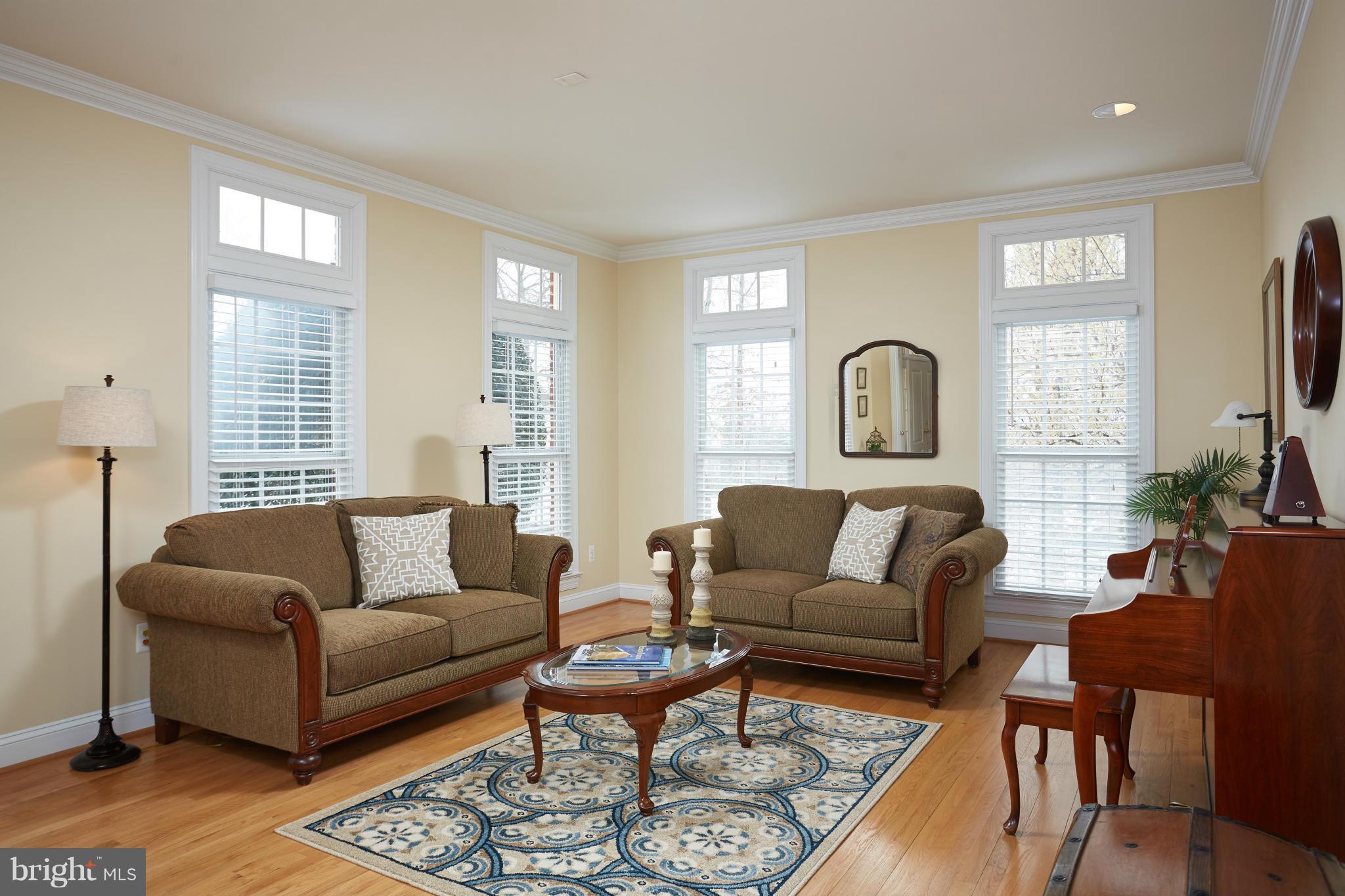 12636 Greenbriar Road Potomac, MD 20854 - Photo 4 of 30 a living room with furniture and a large window