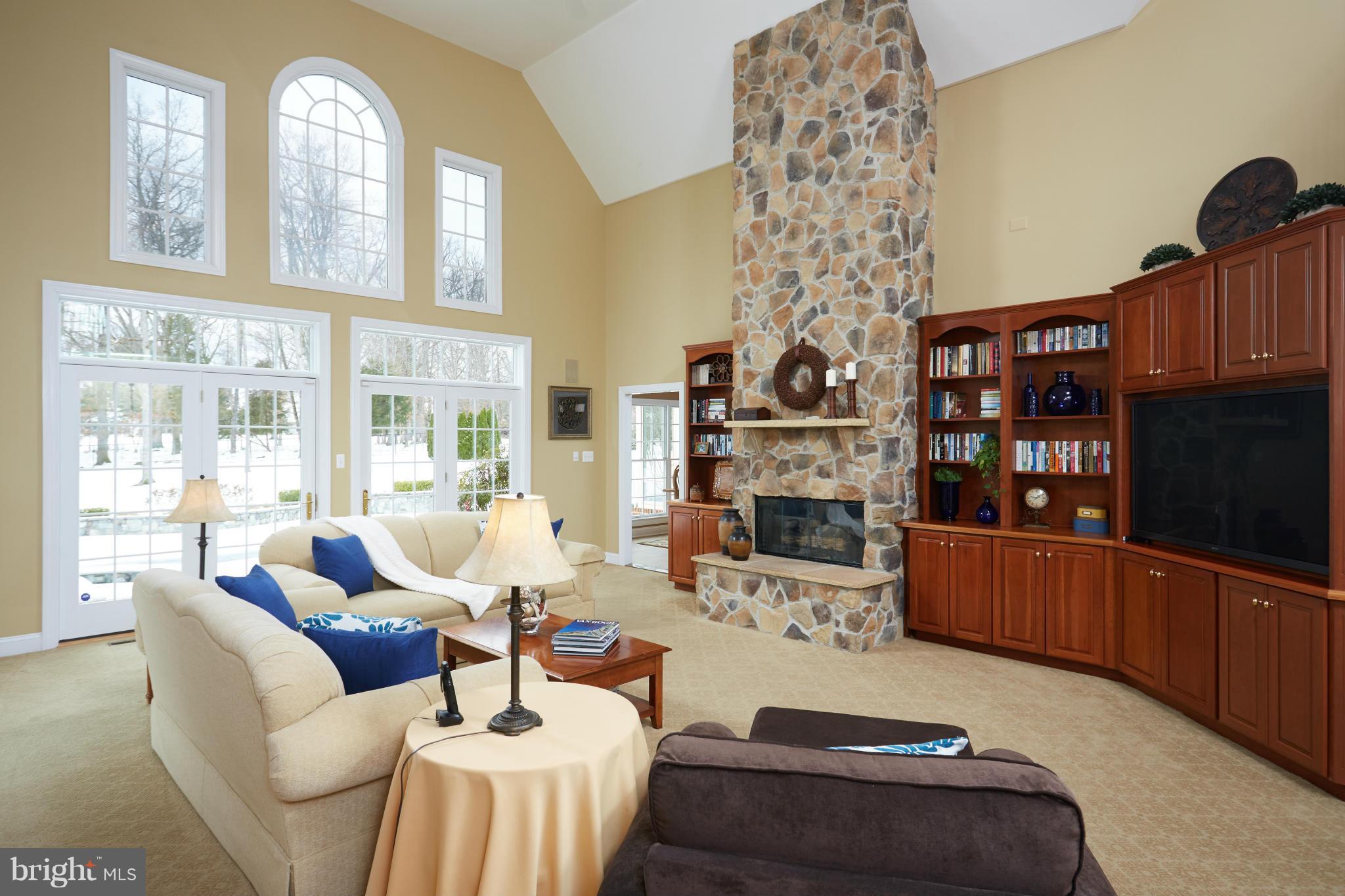 12636 Greenbriar Road Potomac, MD 20854 - Photo 6 of 30 a living room with furniture a fireplace and a large window
