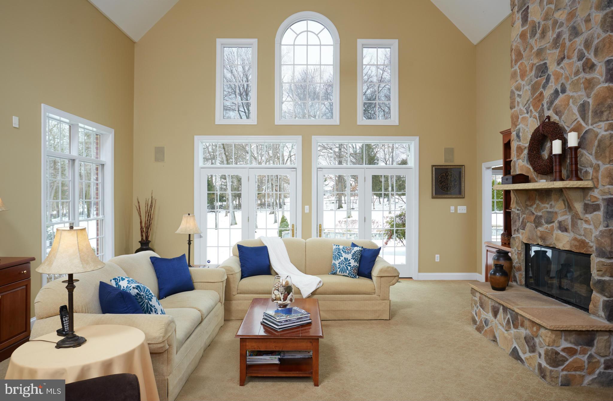 12636 Greenbriar Road Potomac, MD 20854 - Photo 7 of 30 a living room with furniture a fireplace and a large window