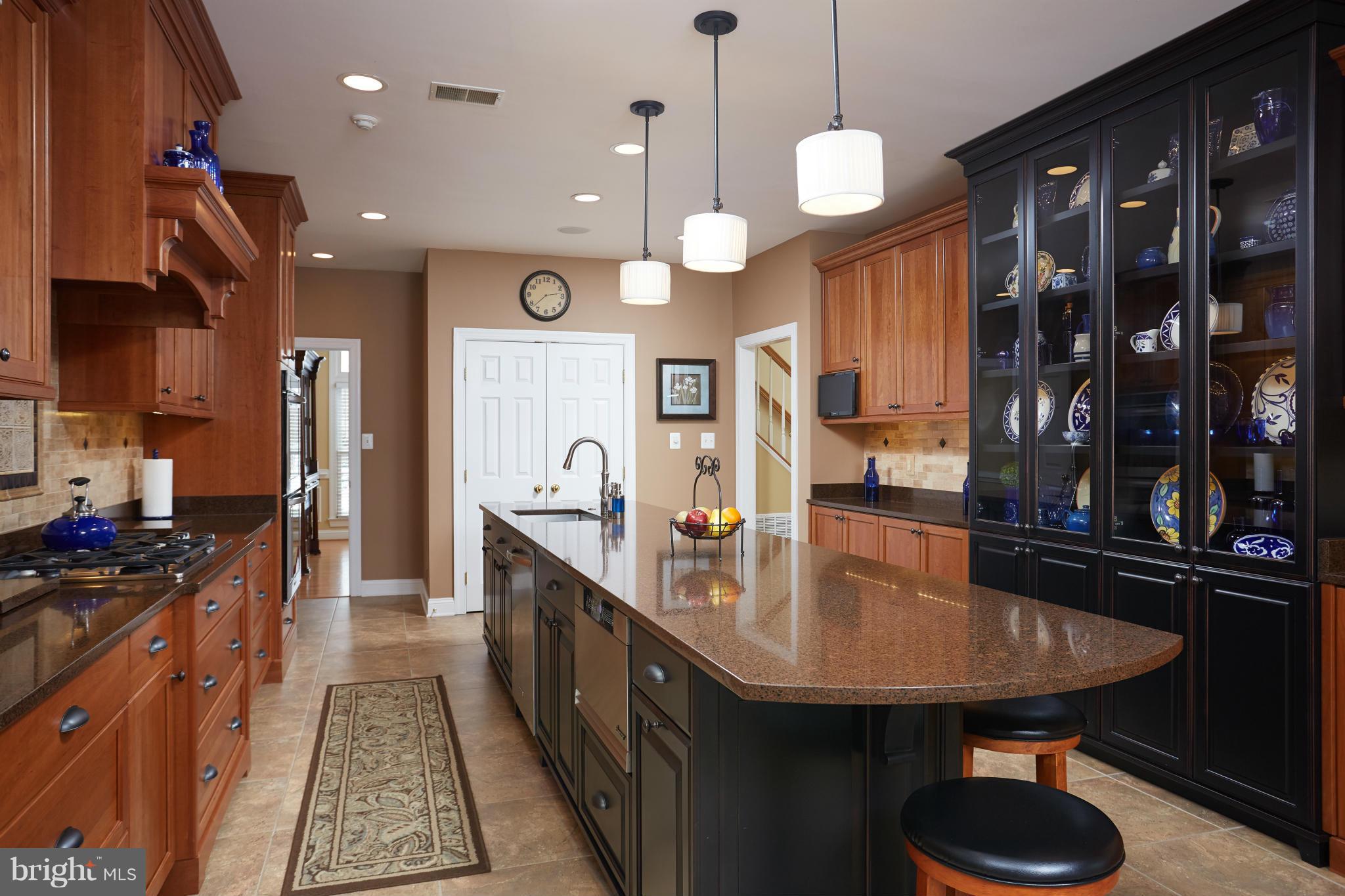 12636 Greenbriar Road Potomac, MD 20854 - Photo 8 of 30 a kitchen with counter space and a sink