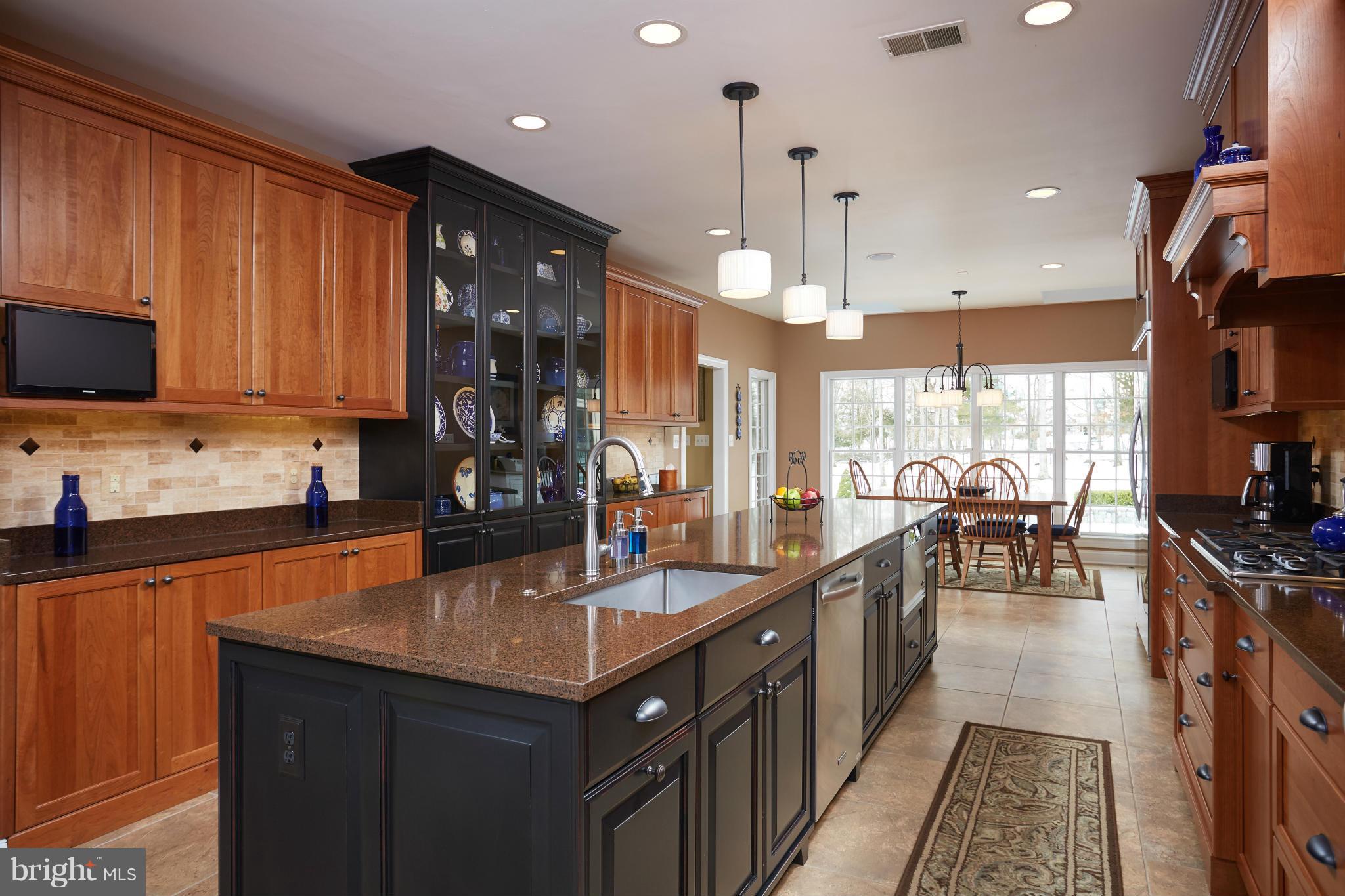 12636 Greenbriar Road Potomac, MD 20854 - Photo 9 of 30 a kitchen with counter top space a sink appliances and cabinets