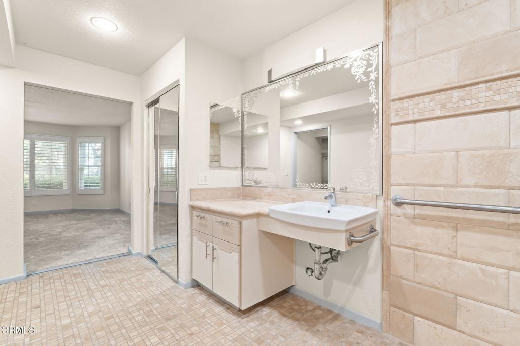 2202 Martinique Lane Oxnard, CA 93035 - Photo 24 of 39 a bathroom with a sink and a mirror