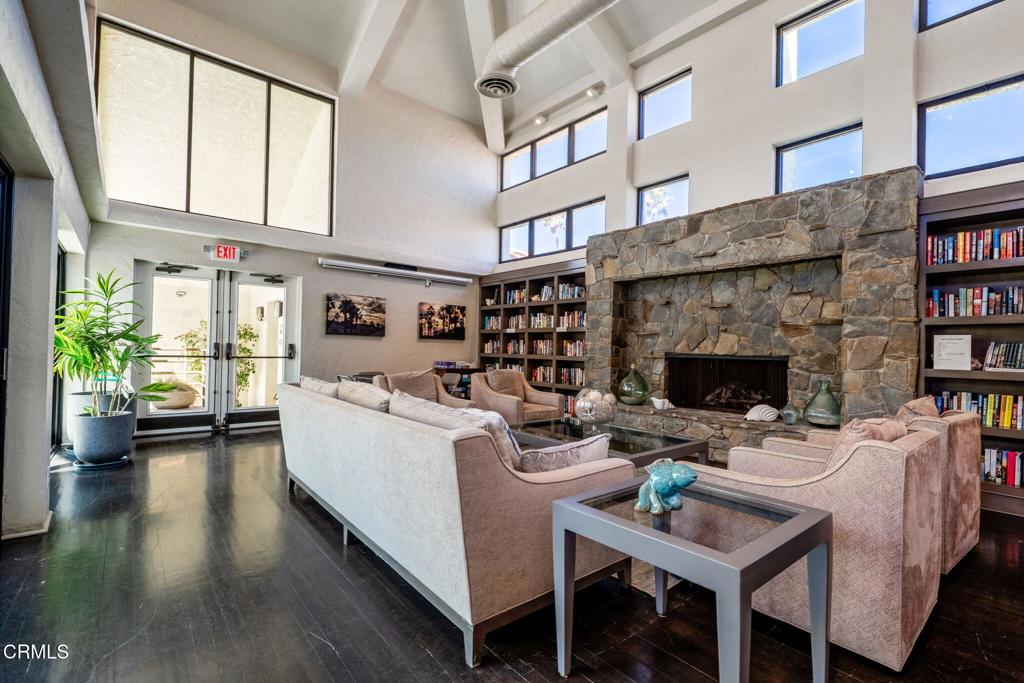 2202 Martinique Lane Oxnard, CA 93035 - Photo 37 of 39 a living room with furniture a fireplace and a large window