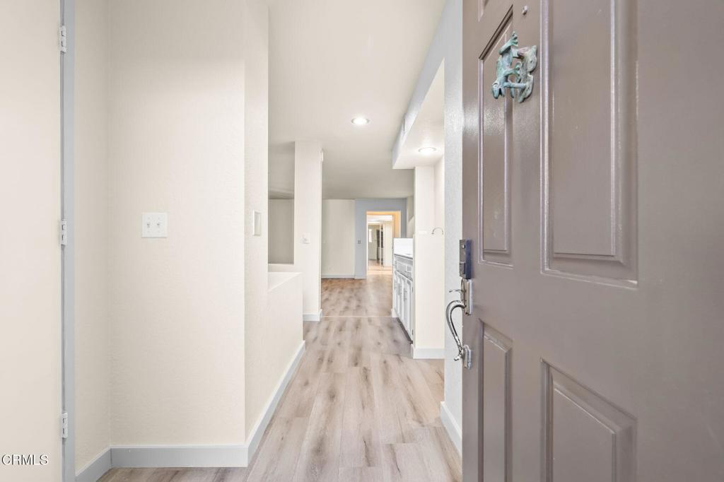 2202 Martinique Lane Oxnard, CA 93035 - Photo 4 of 39 a view of hallway with wooden floor