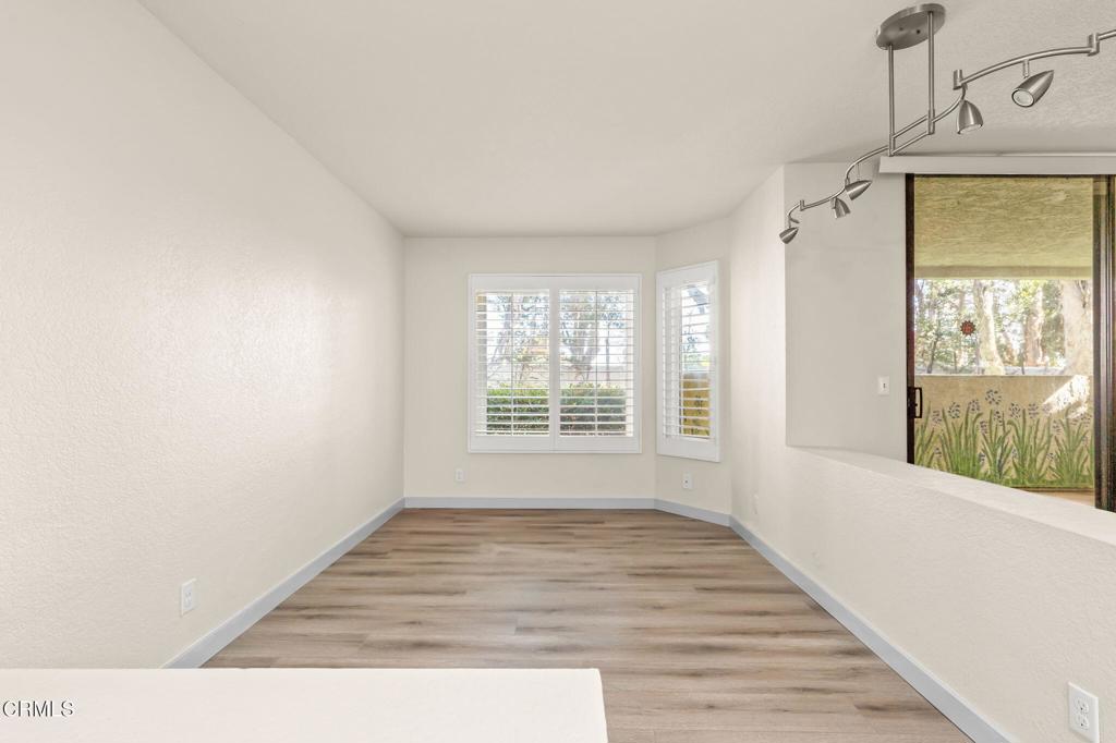 2202 Martinique Lane Oxnard, CA 93035 - Photo 6 of 39 a view of an empty room with wooden floor and a window