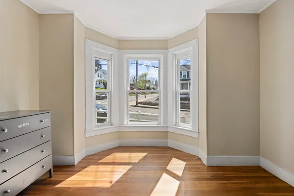 a view of a bedroom with windows