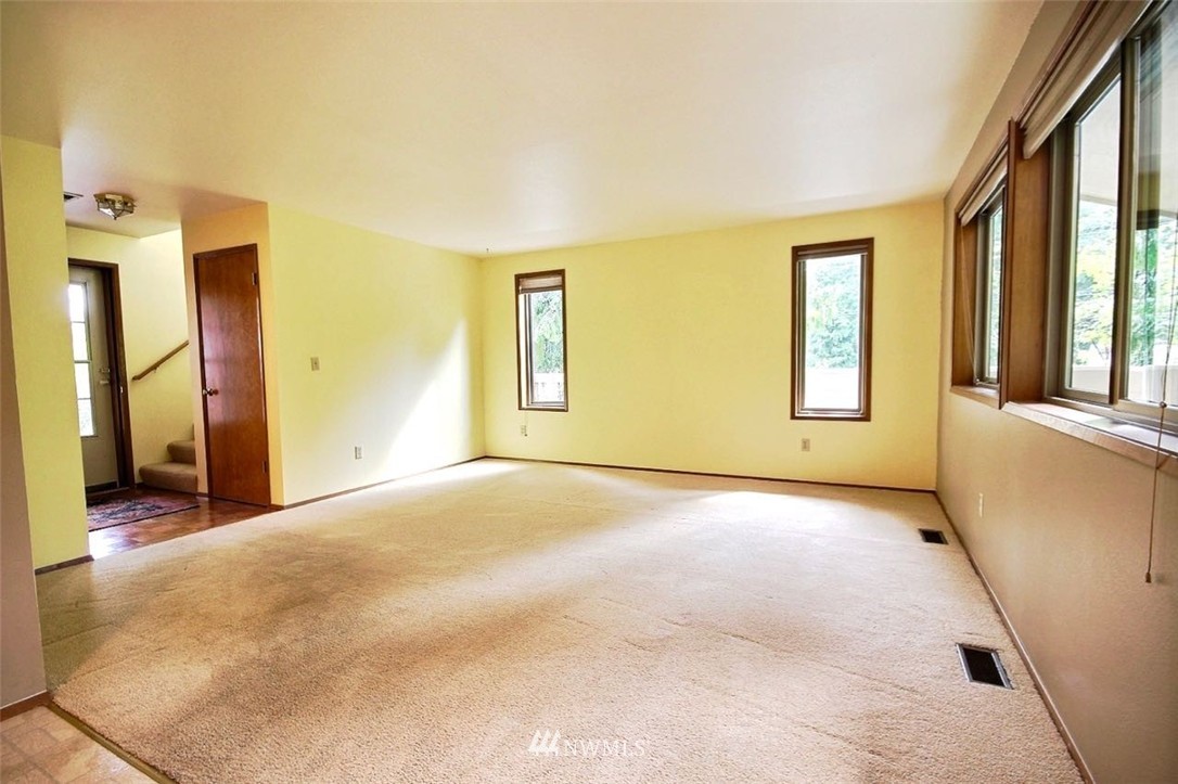 206 170th Place Southwest Bothell, WA 98012 - Photo 3 of 24 a view of an empty room with a window