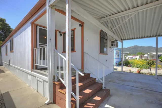 a view of an house with porch and wooden floor