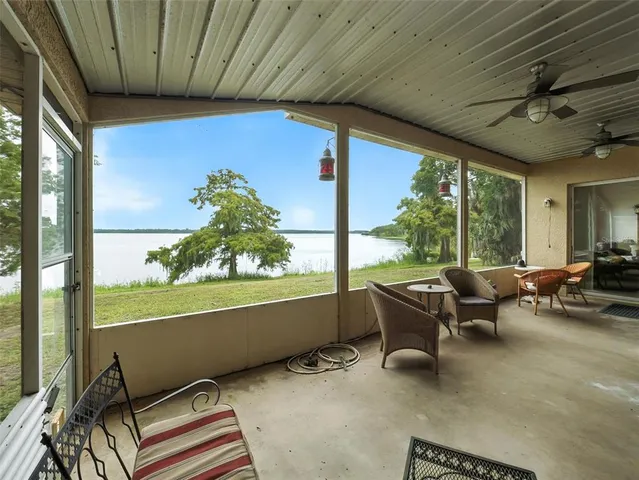a room with furniture and a large window
