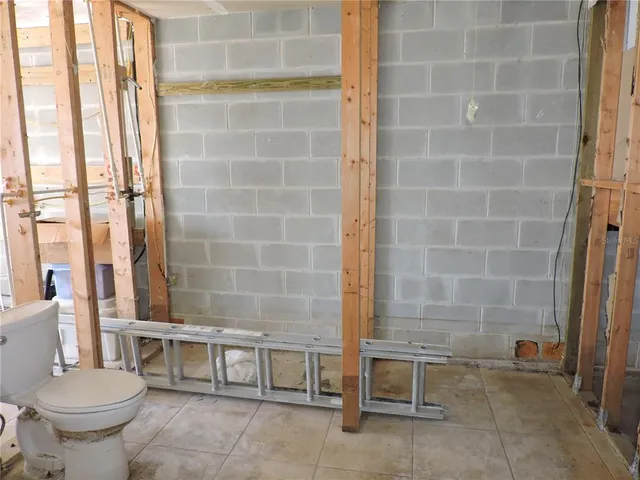 a bathroom with a toilet and a sink