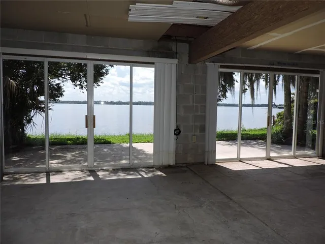 a view of a porch with a floor to ceiling window