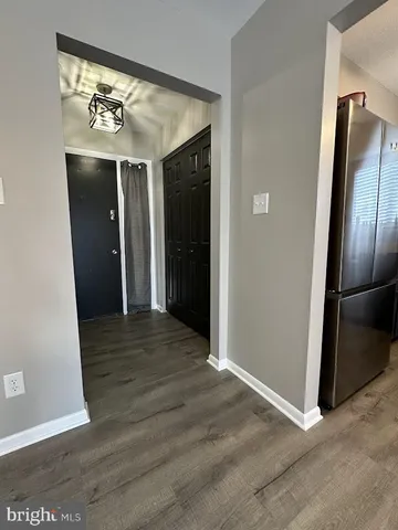 a view of an entryway with washer and dryer