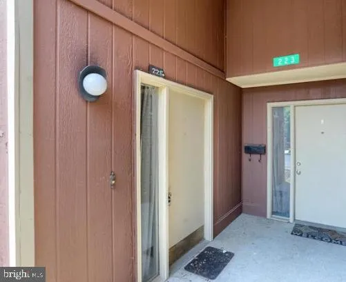 a view of a house with a wooden fence