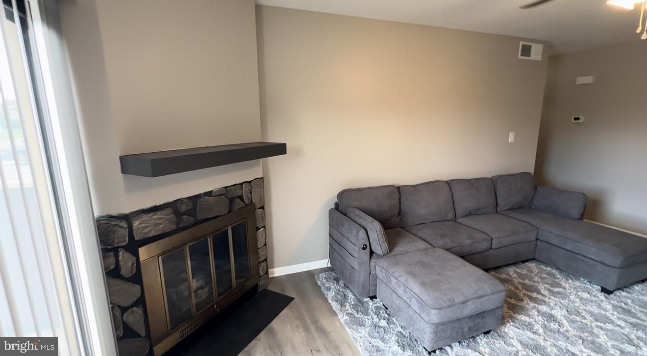 221 Lee Court Enola, PA 17025 - Photo 7 of 22 a living room with furniture and a fireplace