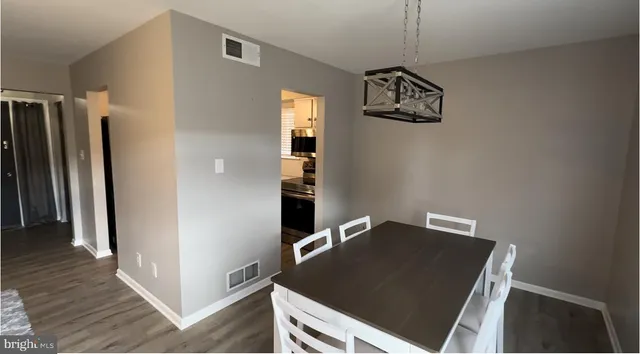 a view of a hallway with a front door