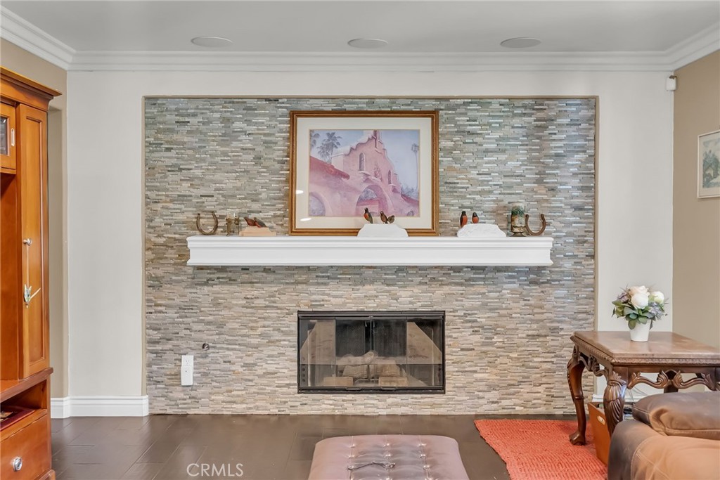 7384 Golden Star Avenue Riverside, CA 92506 - Photo 13 of 57 a living room with furniture a fireplace and a table