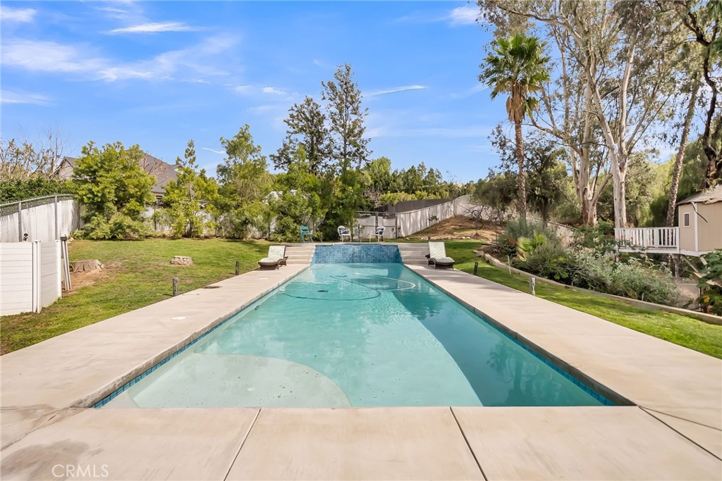 7384 Golden Star Avenue Riverside, CA 92506 - Photo 31 of 57 a view of swimming pool with a yard