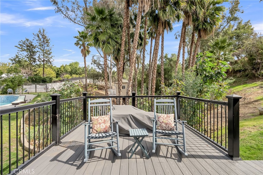 7384 Golden Star Avenue Riverside, CA 92506 - Photo 45 of 57 a view of a balcony with mountain view and wooden floor