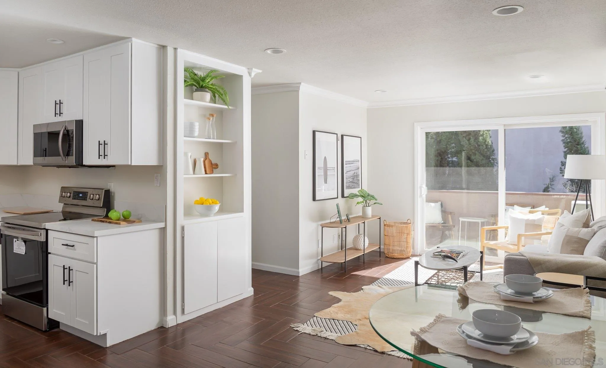 a living room with kitchen island furniture and a wooden floor