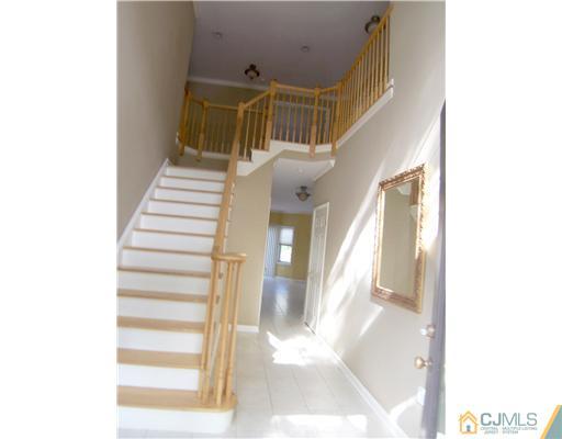 34 West Hill Road Colonia, NJ 07067 - Photo 2 of 25 a view of entryway and hall with wooden floor