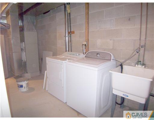 34 West Hill Road Colonia, NJ 07067 - Photo 22 of 25 a utility room with dryer and washer