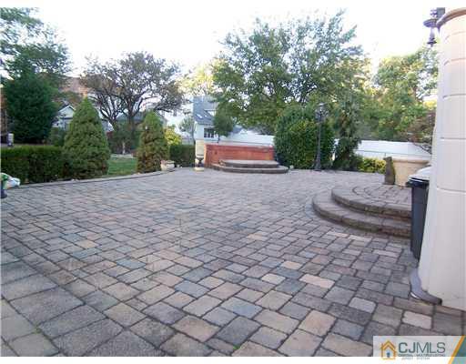 34 West Hill Road Colonia, NJ 07067 - Photo 24 of 25 a view of backyard with a table and chair