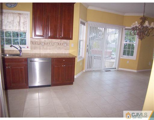 34 West Hill Road Colonia, NJ 07067 - Photo 4 of 25 a view of kitchen with stainless steel appliances granite countertop a stove and a sink
