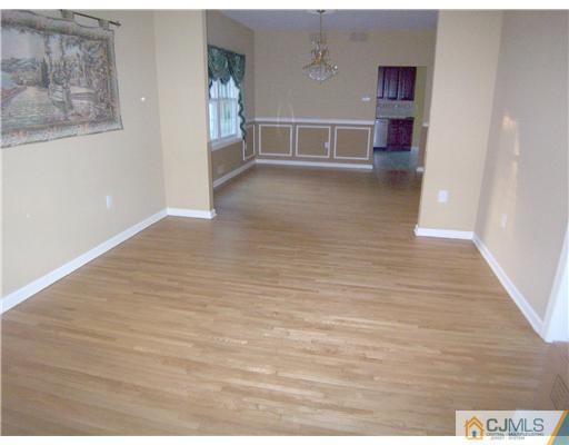 34 West Hill Road Colonia, NJ 07067 - Photo 8 of 25 a view of a room with wooden floor and windows