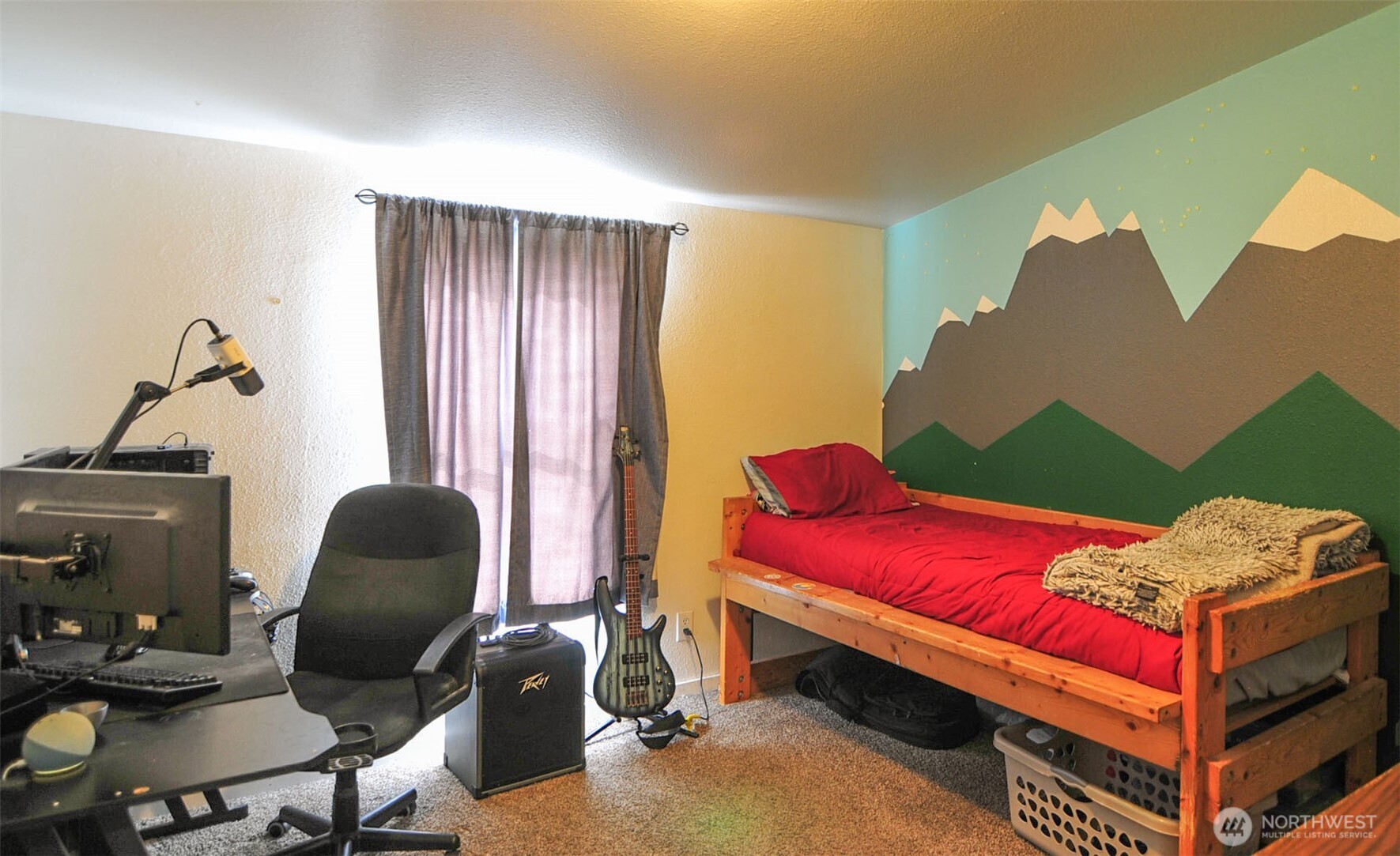 1698 Sunset Drive Wenatchee, WA 98801 - Photo 11 of 22 a bedroom with a bed and a chair