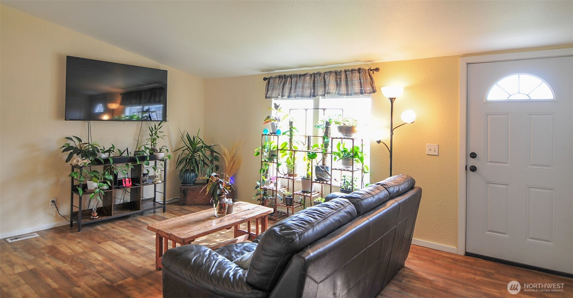 1698 Sunset Drive Wenatchee, WA 98801 - Photo 2 of 22 a living room with furniture and a flat screen tv