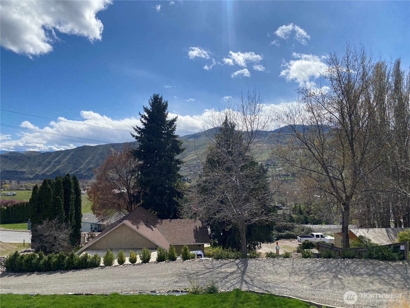 1698 Sunset Drive Wenatchee, WA 98801 - Photo 21 of 22 a view of a house with yard and tree s