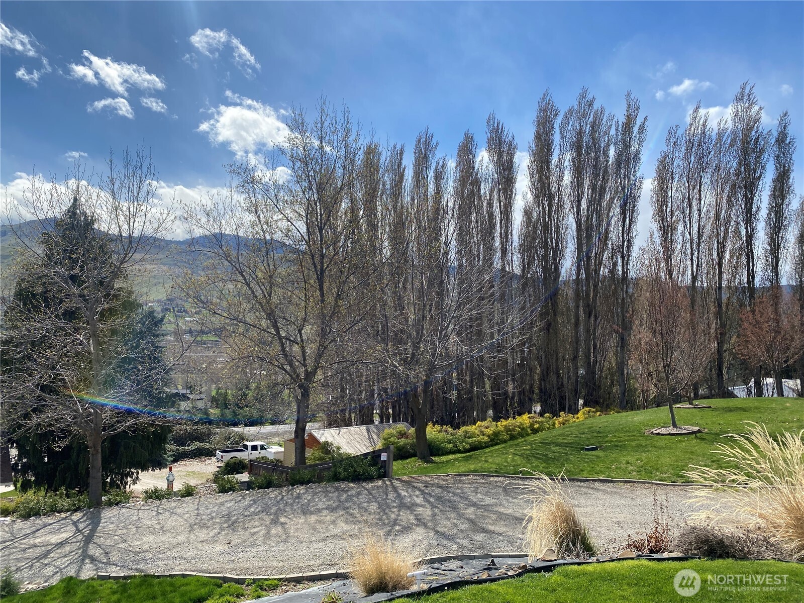 1698 Sunset Drive Wenatchee, WA 98801 - Photo 22 of 22 a view of a yard with lots of green space