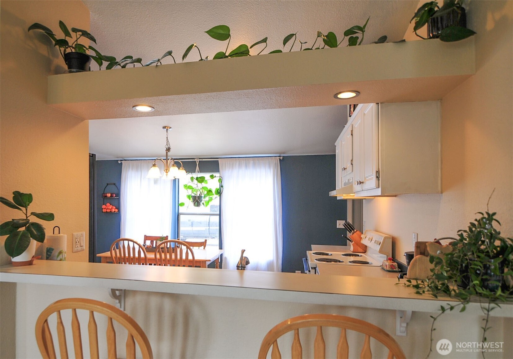 1698 Sunset Drive Wenatchee, WA 98801 - Photo 5 of 22 a kitchen with stainless steel appliances a sink a stove and a wooden floor